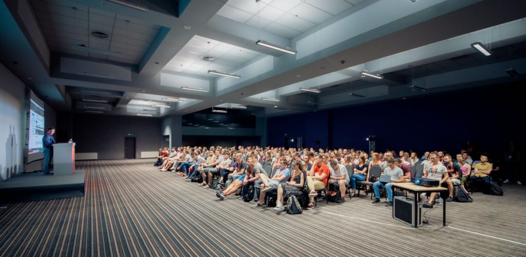 Auditorium listening to a keynote on serverless